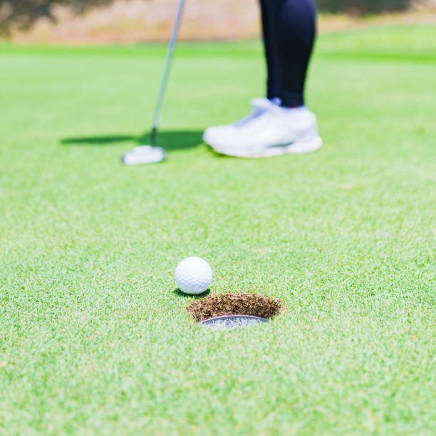 istock putter and golf ball on the green 1330507536