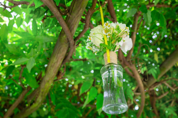 istock glass vase with roses and wild flowers 1330508100
