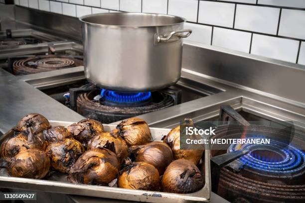 Professional Restaurant Stainless Steel Kitchen With Cooking Pot Roasted Onion Tray Stock Photo - Download Image Now