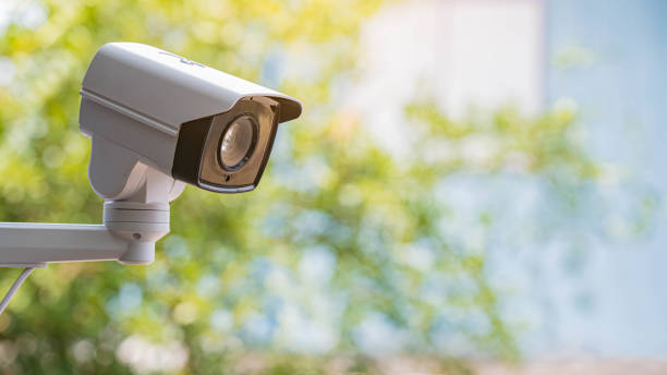 istock IP CCTV camera install by have water proof cover to protect camera with home security system concept with blur background. 1330510721
