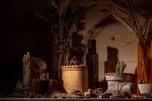 Still life in the genre of Fantasy. Potion bottles, candle, medicine, broken amphora. Ingredients for making the potion.
