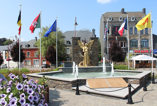 Bertrix, Belgium, 20 July 2021: View of the War memorial  and main square in Bertrix in the province of Luxembourg. It is a small town in the Ardennes and a popular vacation destination.