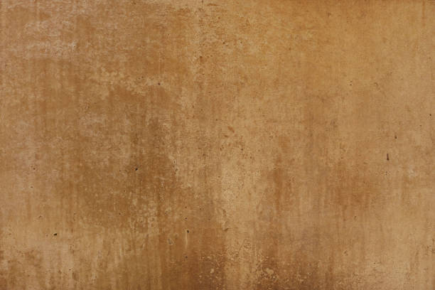 istock old empty stone wall surface or ancient dirty brown paper texture background in brown or beige color with moisture marks 1330513341