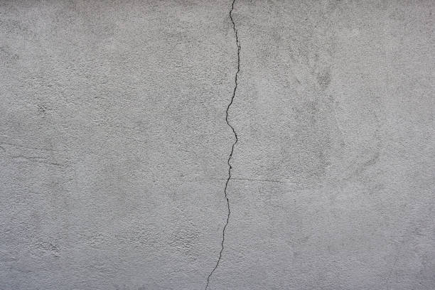 istock cracked wall with little popcorn ceiling texture of a blank surface in gray color 1330513802