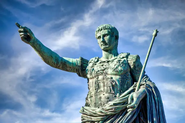 Italy, Rome. Statue in a public street of the roman emperor Gaius Julius Caesar. Concept for authority, domination, leadership and guidance.