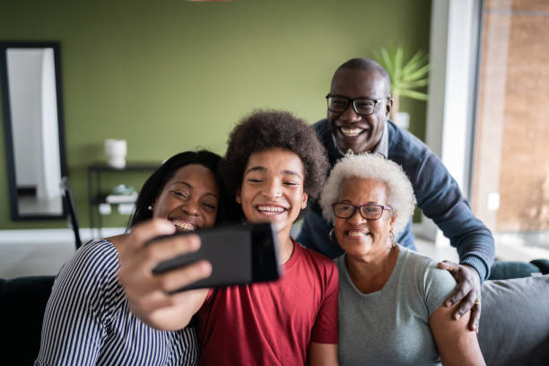 istock Multi generation family taking a selfie or doing a video call at home 1330517258