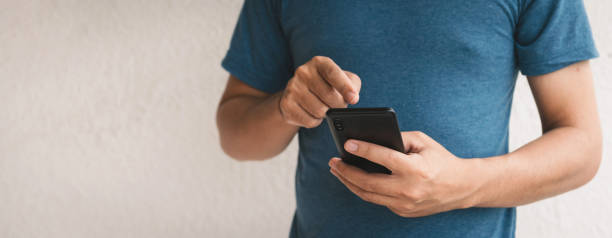 istock Man using cellphone for searching data and social media on internet. 1330517475