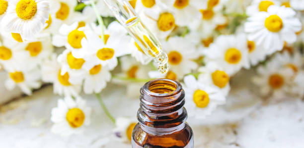 istock Medicinal herbs in bottles. chamomile oil extract. Selective focus. 1330519136