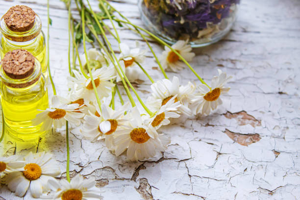 istock Medicinal herbs in bottles. chamomile oil extract. Selective focus. 1330519166