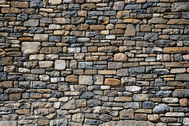 istock slate and sandstone Stone wall background 1330519265