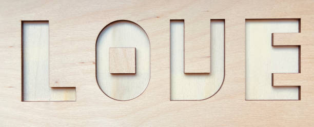 istock Deep-drawn word love in a wooden part, diy 1330520594