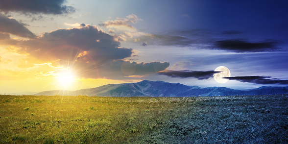 day and night time change concept above alpine mountain meadow in summer. beautiful landscape of carpathians with sun and moon on the sky