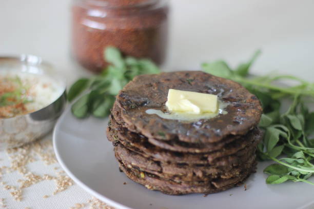 istock Flatbread with finger millet and fenugreek leaves served with masala curd. It is also called Nachni methi thepla, a healthy and tasty flat bread from Gujarat, India 1330522150