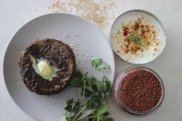 istock Flatbread with finger millet and fenugreek leaves served with masala curd. It is also called Nachni methi thepla, a healthy and tasty flat bread from Gujarat, India 1330522661