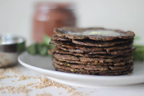 istock Flatbread with finger millet and fenugreek leaves served with masala curd. It is also called Nachni methi thepla, a healthy and tasty flat bread from Gujarat, India 1330522688