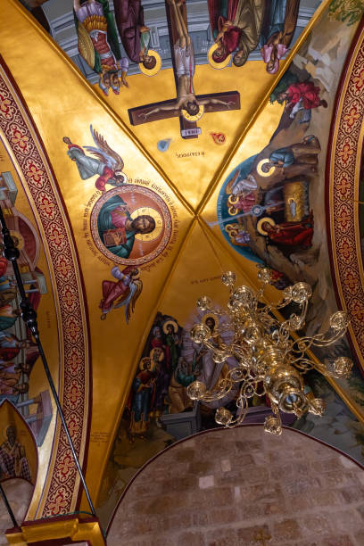 istock A large  decorative lamp hangs from a ceiling painted on religious themes in a hall in the small monastery of St. George on the border of the Jewish and Armenian quarters in the old city of Jerusalem, Israel 1330522749