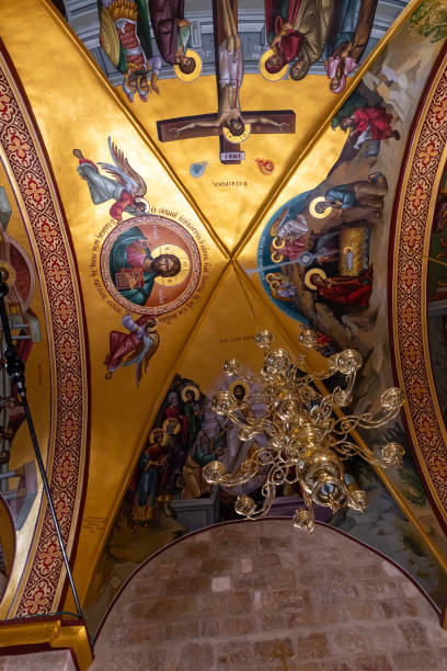 istock A large  decorative lamp hangs from a ceiling painted on religious themes in a hall in the small monastery of St. George on the border of the Jewish and Armenian quarters in the old city of Jerusalem, Israel 1330522872