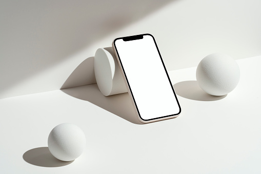 White blank screen smart phone mockup, template with abstract geometric objects on white background