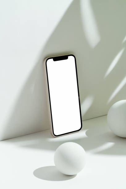 istock White blank screen smart phone mockup, template with speheres 1330529112