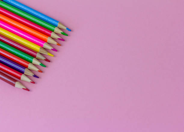 istock Colored bright pencils on a pink background with a copy of the space., 1330531498