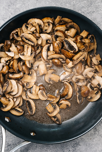Overhead photo of sauteed cremini mushrooms with steam in Frederick, Maryland, United States