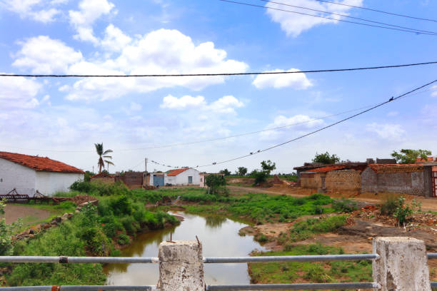 istock Village old House river flowing 1330534055