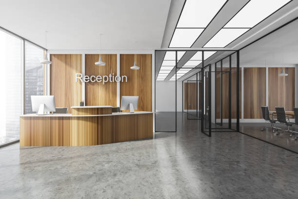 istock Wooden reception interior with desk and computers near window, hall with rooms 1330535863