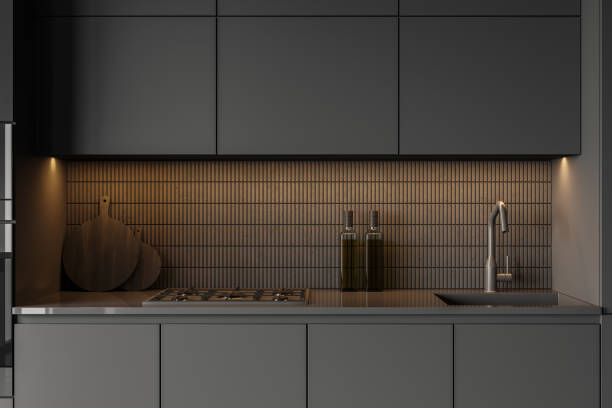 istock Gray kitchen countertop with sink and cooker 1330536709