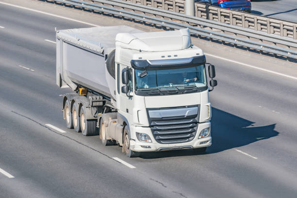 istock Freight truck with bulk cargo moves on the highway. 1330536846