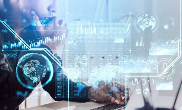 istock African American businessman working on laptop, office workspace interior, blue glowing information security padlock and business data symbols. Concept of cyber protection and data storage 1330537109