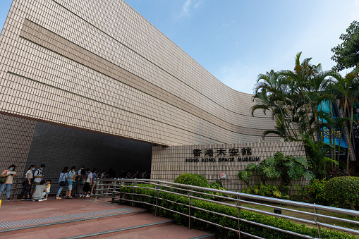 Hong Kong - July 25, 2021 : People queuing at Hong Kong Space Museum in Tsim Sha Tsui, Kowloon, Hong Kong. It is an astronomy and space science museum.