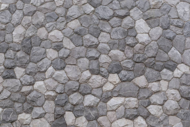 istock pattern of modern style decorative uneven cracked real gray color stone wall surface with cement 1330538050