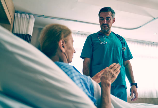 istock A doctor talking with old patient for explaining symptom of sick 1330540210