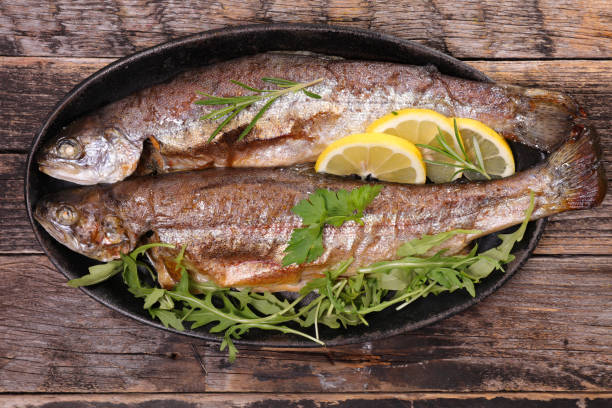 istock baked fish and lemon- top view 1330543237