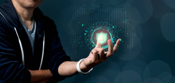 istock Man holding shield icon as a Privacy Technology to protect and safe data on cyberspace network 1330544334