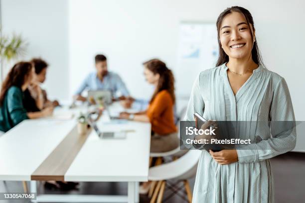 Doing Business With A Smile Stock Photo - Download Image Now - Office, Asian and Indian Ethnicities, Business Person