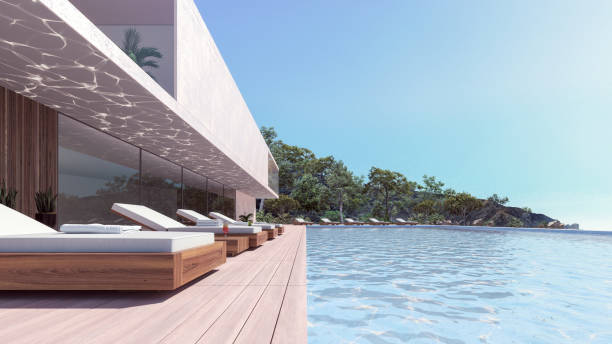 istock Modern luxury house exterior with swimming pool and deck chairs 1330547167