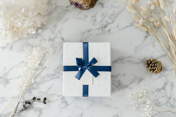 istock White gift box with blue bow and ribbon 1330548382
