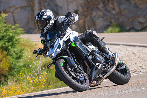 biker riding on his motorbike. Photograph captured on July 4, 2021 in the port of Navalmoral, province of Avila, Spain