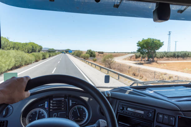 Panoramic view from inside a truck driving on a highway. Panoramic view from inside a truck driving on a highway. vehicle interior photos stock pictures, royalty-free photos & images