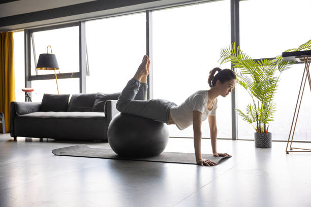 istock Woman stretching yoga using ball 1330550563