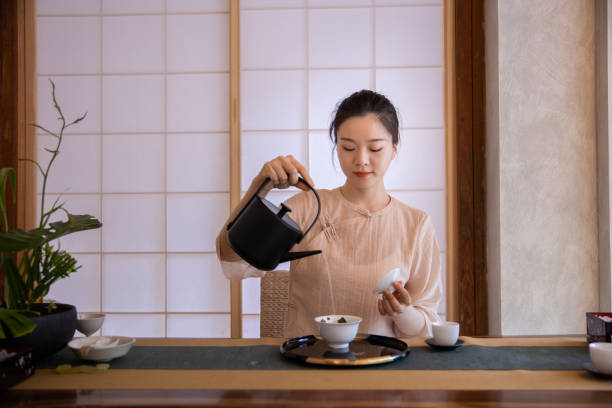 Woman making Chinese tea in a tea ceremony
