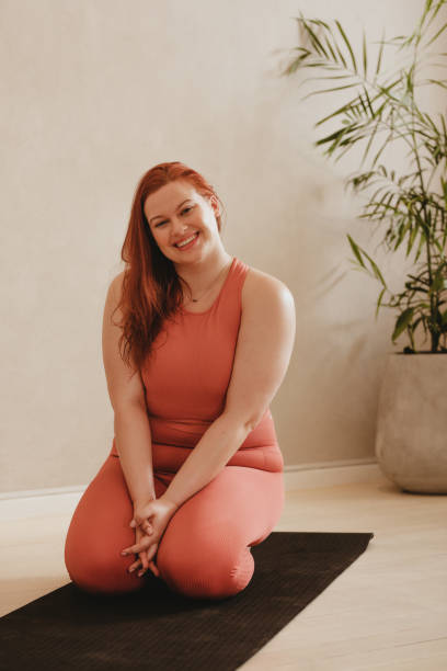 istock Woman taking a break after yoga workout at home 1330552980