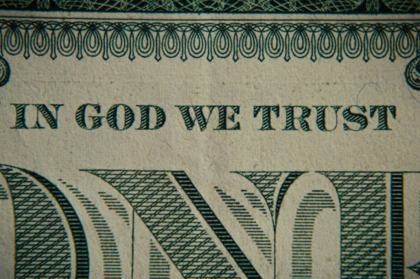 istock In God We Trust inscription on a dollar bill, macro 1330553120