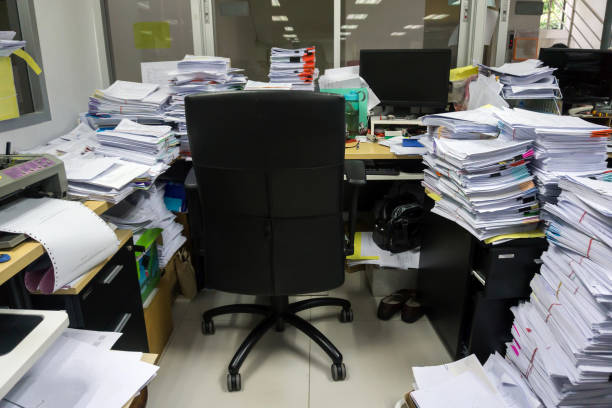 istock Busy, messy and cluttered workplace, full of documents 1330553158