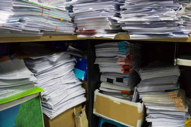 istock Busy, messy and cluttered workplace, full of documents 1330553174