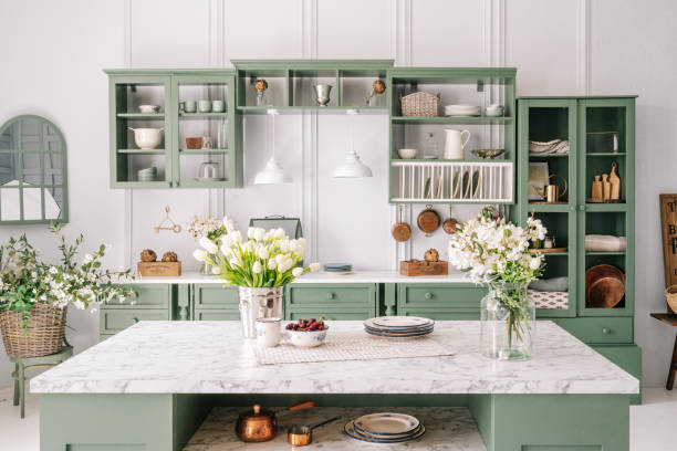 istock Comfortable apartment kitchen interior with green furniture 1330554379