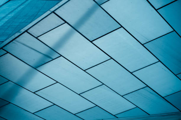 istock underside panoramic and perspective view to steel blue glass high rise building skyscrapers, business concept of successful industrial architecture 1330554621