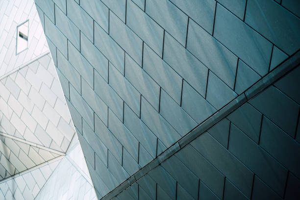 istock underside panoramic and perspective view to steel blue glass high rise building skyscrapers, business concept of successful industrial architecture 1330554879