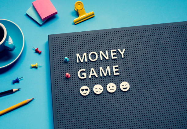 istock Money game with text on desk.strategy and plan. 1330555713